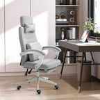 Light grey fabric office chair with high back, headrest and lumbar pillows, retractable footrest
