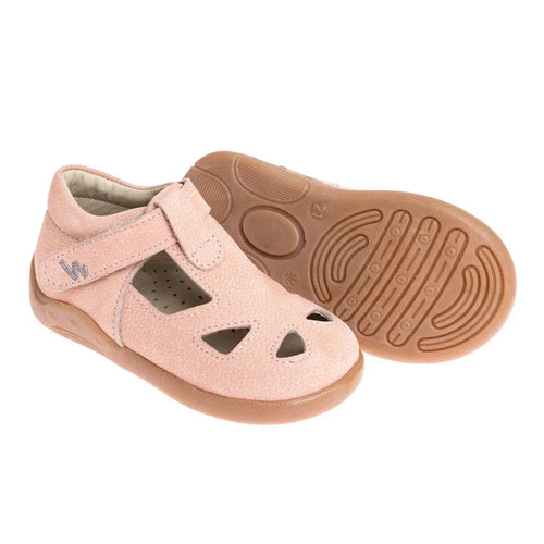 Light pink sandals showing textured rubber outsole and hook-and-loop strap closure