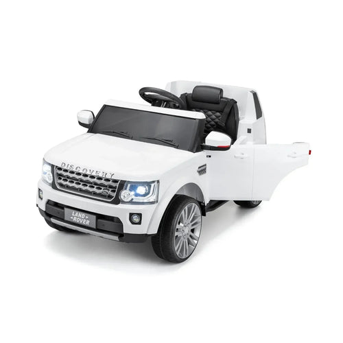 White 12V ride-on Land Rover Discovery with open cabin, black seats, and front grille lights