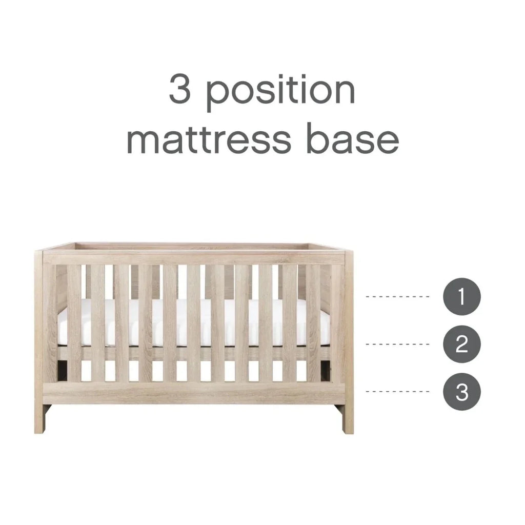 Light oak cot bed showing three mattress base height positions