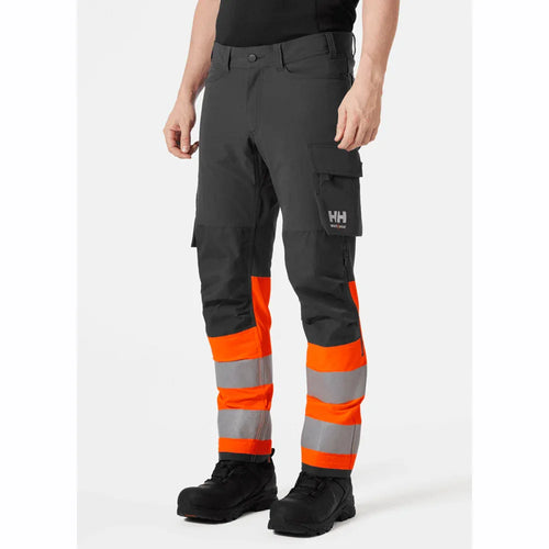 Hi-vis cargo pants in dark fabric with orange reflective bands and side cargo pockets.