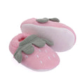 Pink baby booties with gray leaf appliqués and dotted soles