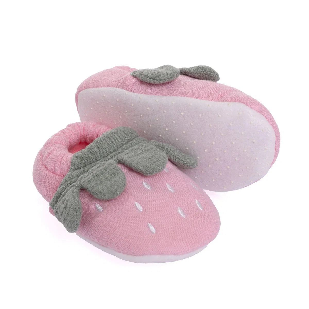 Pink baby booties with gray leaf appliqués and dotted soles