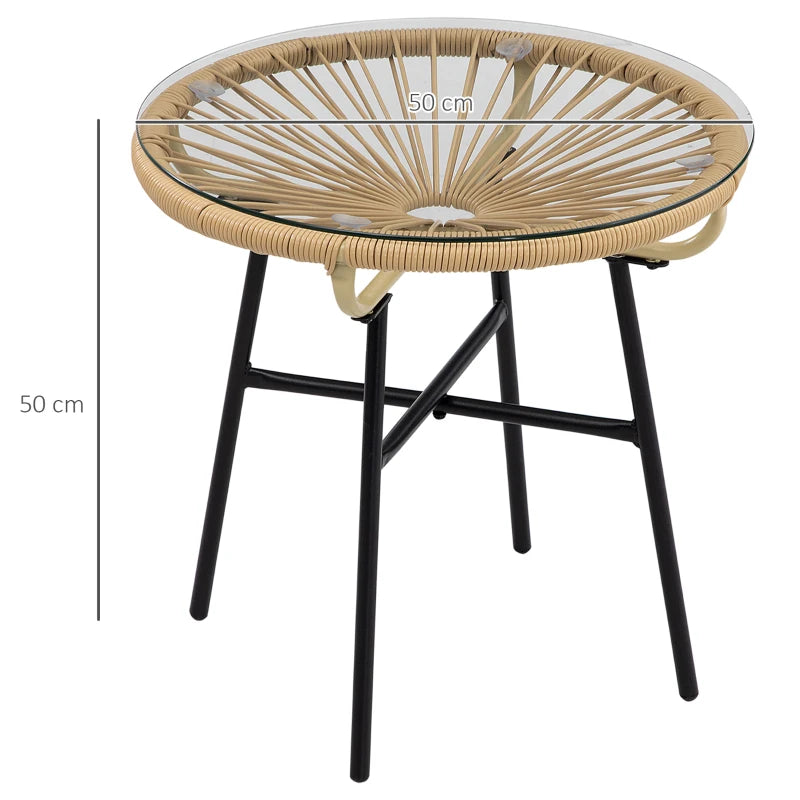 Round rattan coffee table with clear tempered glass top and four black metal legs