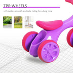 Purple baby balance bike with pink TPR wheels and curved padded seat
