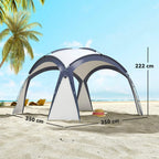 Cream and blue gazebo tent on sand with two front leg supports and roof arches