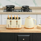 Beige kettle and 4-slice toaster set on wooden counter with copper accents