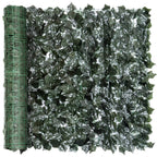 Close-up of dark green artificial leaf hedge screen panel with green grid backing.