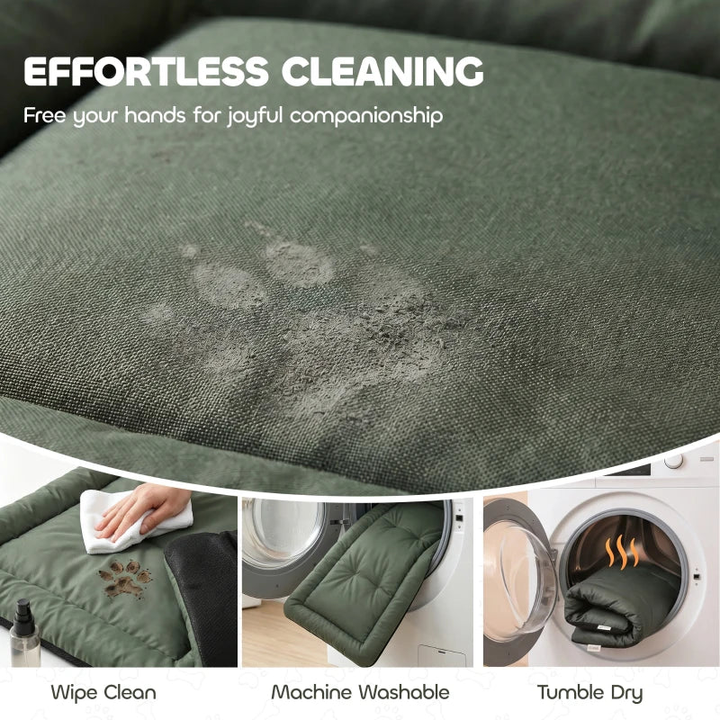 Green quilted pet bed cover with visible stain spot for cleaning