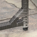 Close-up of grey rattan chair leg and base with woven joint detail