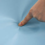 Close-up of smooth light blue PU foam cover being pressed by a hand