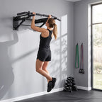 Wall-mounted pull-up bar with chin-up grip bar and resistance band anchor points