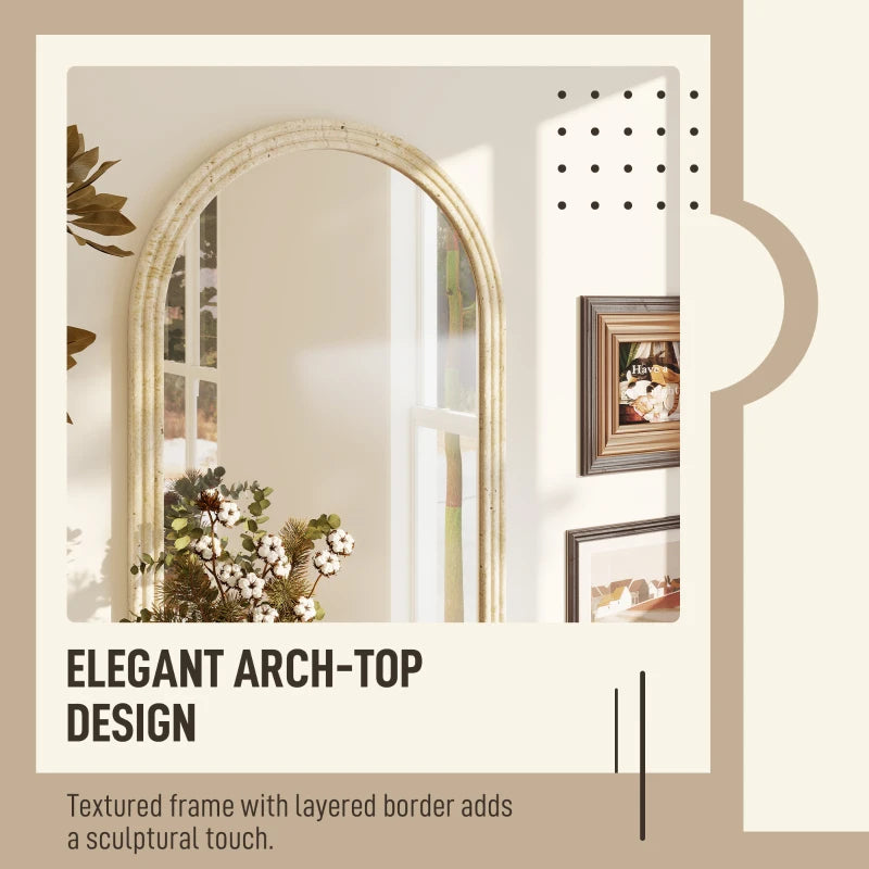 Arched wall mirror with beige textured frame and layered border detail