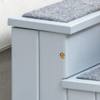 Side view of gray pet stairs with gold handle and carpeted step