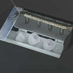 Open ice maker bin with molded ice cubes inside, ready for dispensing