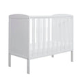 White space-saver cot with slatted sides and end panels