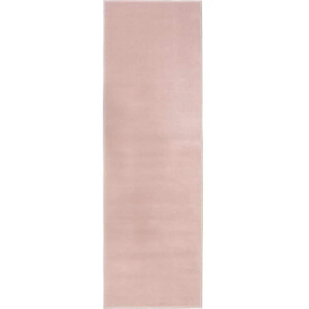 Solid pink rectangular area rug, low even pile with flat edge