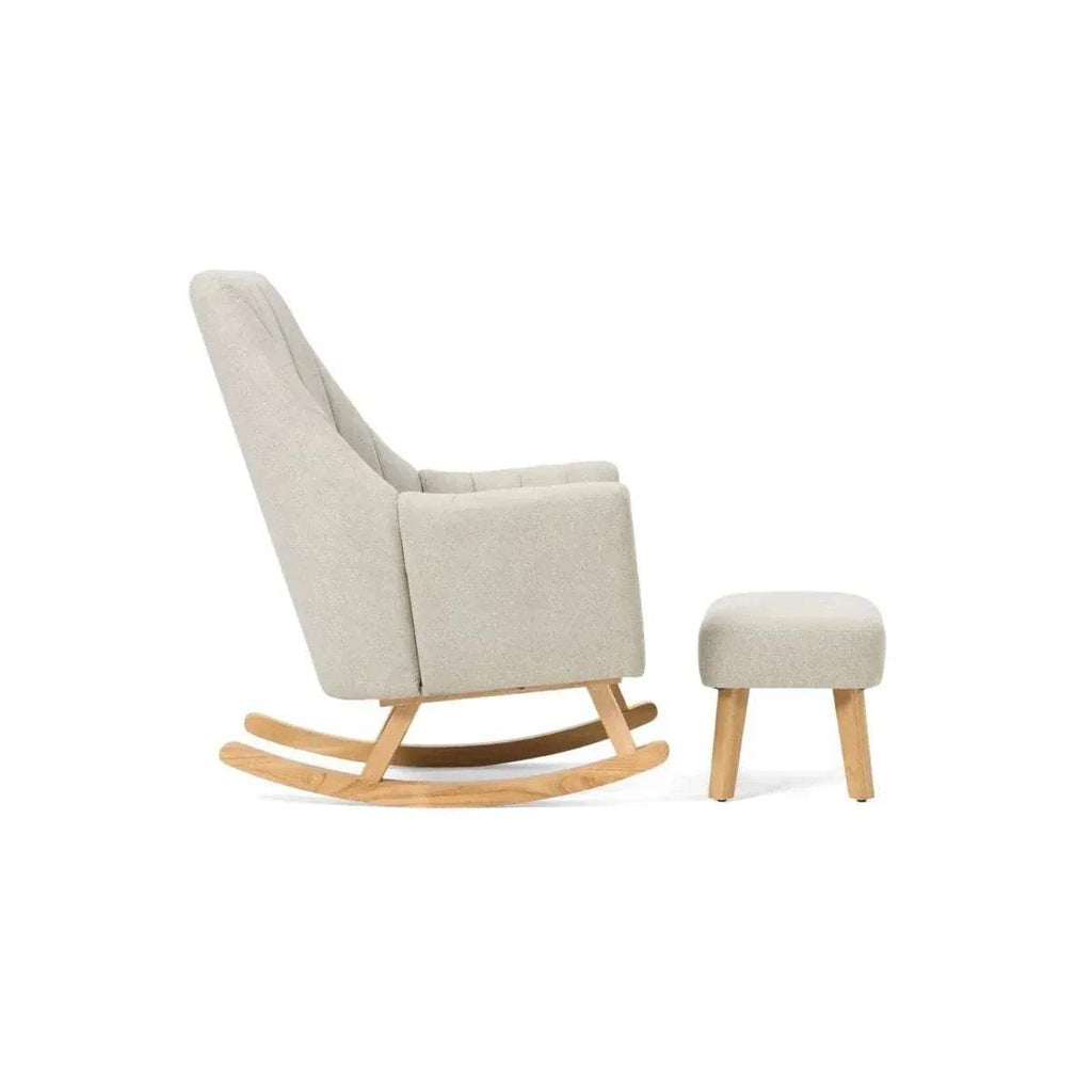 Beige rocking chair with matching beige foot stool and light wood rockers