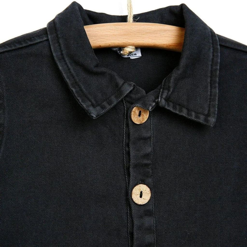 Dark anthracite baby jacket close-up: spread collar and wooden button placket