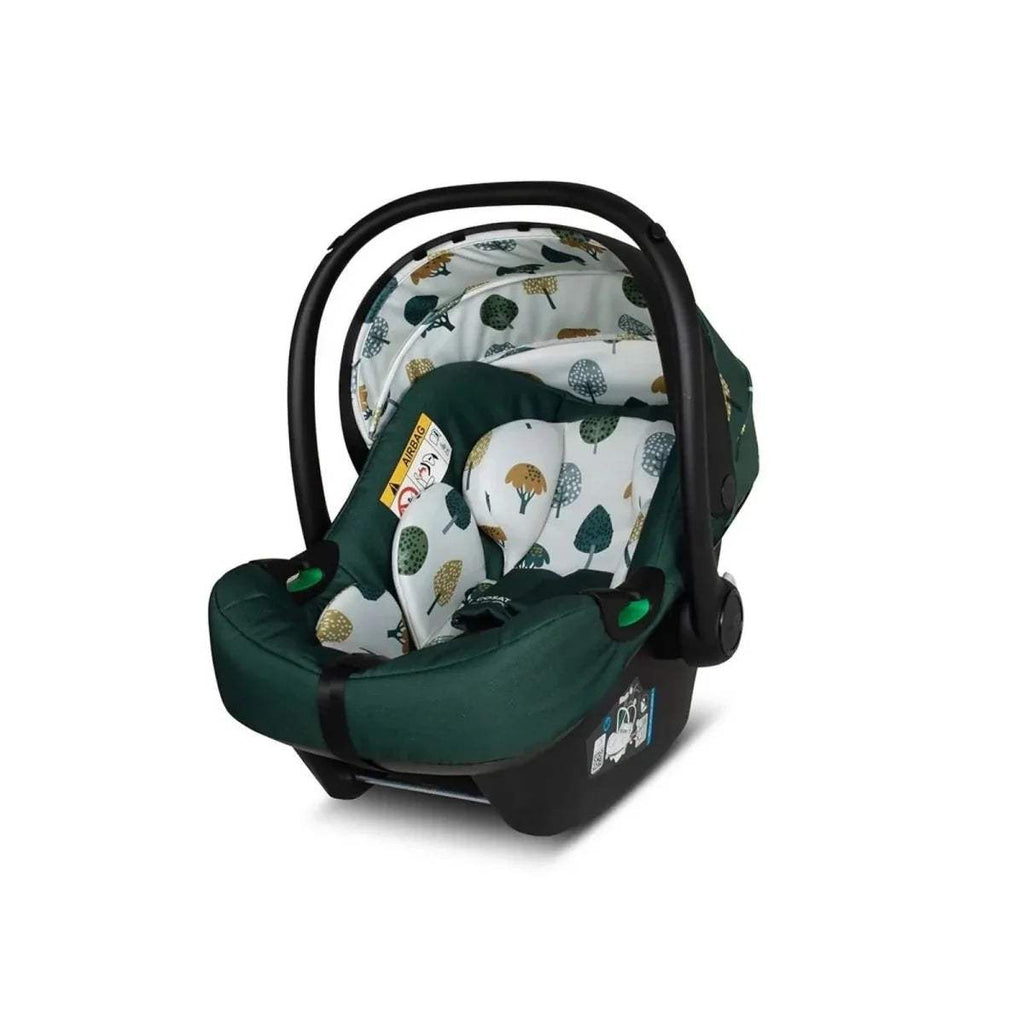 Green infant car seat with patterned insert and curved handle, side view