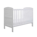 White mini cot bed frame with vertical slats and rounded corner posts