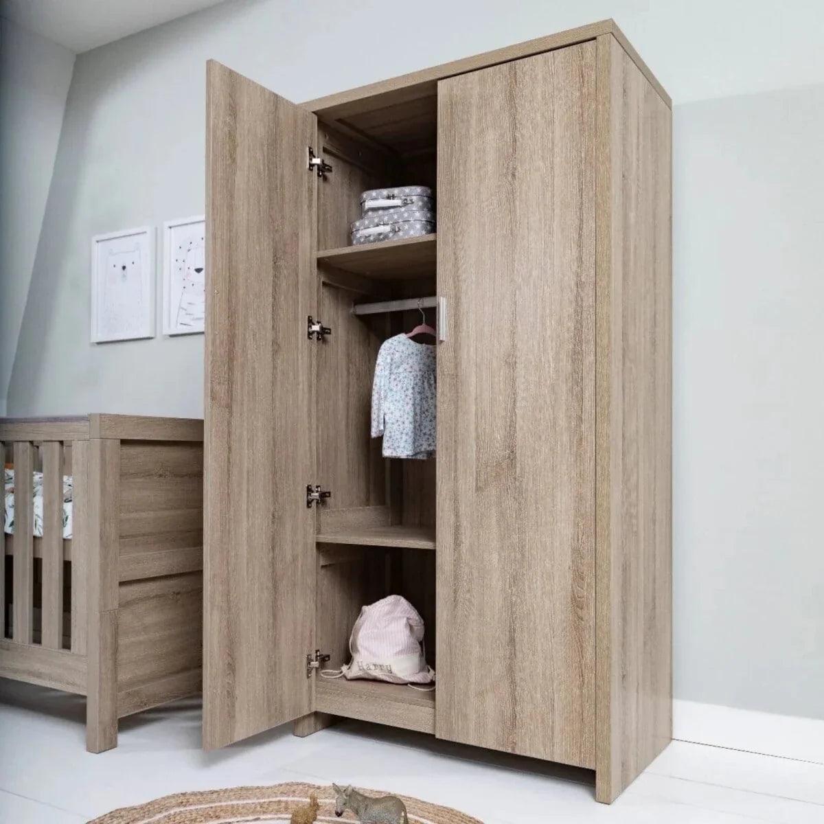 Oak wardrobe with open doors, showing multiple shelves for folded and stacked items