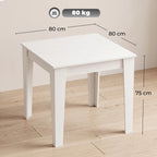 White square kitchen dining table showing tabletop and sturdy leg frame.