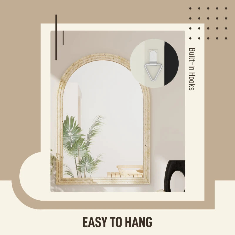 Beige arched wall mirror with grooved frame and wall hanging hooks