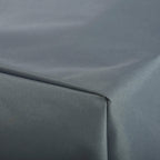 Close-up of grey woven Oxford fabric patio sofa cover edge and stitched seam