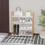 Four-tier shoe rack in natural wood with white slatted shelves holding shoes and boots
