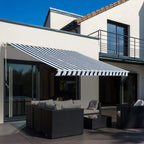 Blue and white striped retractable patio awning extended over outdoor seating