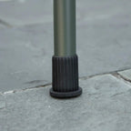 Green BBQ grill leg with black rubber foot cap for stable, non-slip footing
