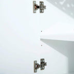 White cabinet interior with metal hinges on the inside panels