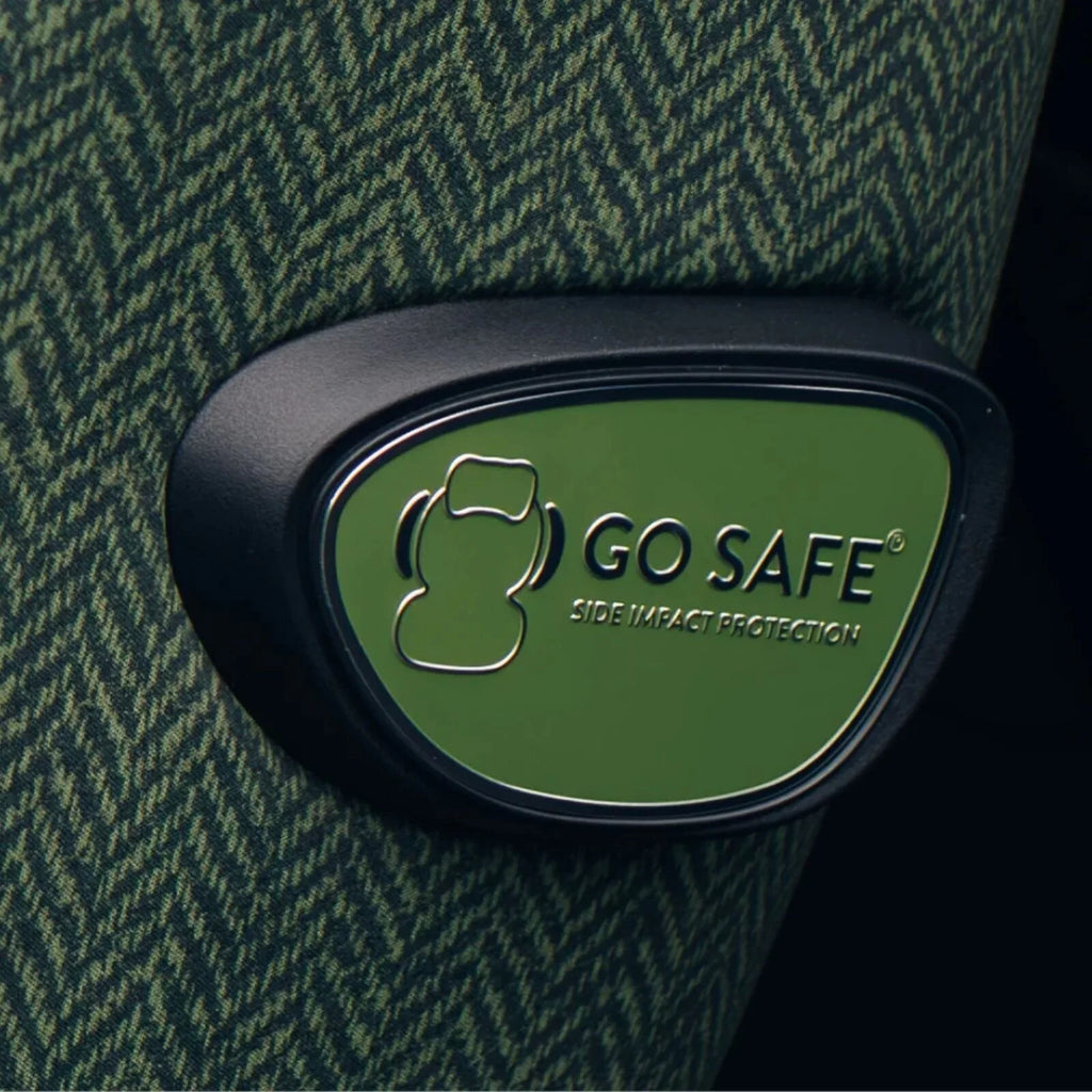Go Safe side-impact protection badge on green Cosatto car seat side cushion