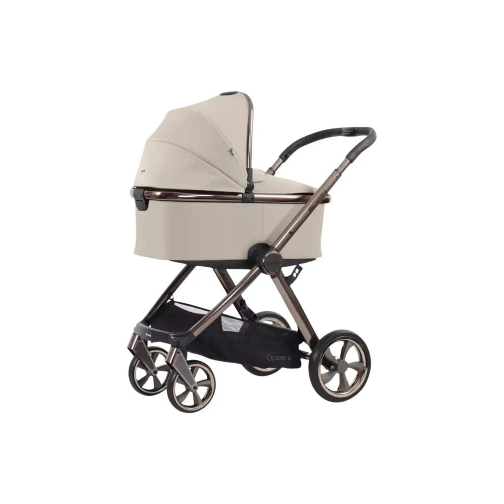 Buttermilk stroller carrycot with raised hood and black undercarriage, side view