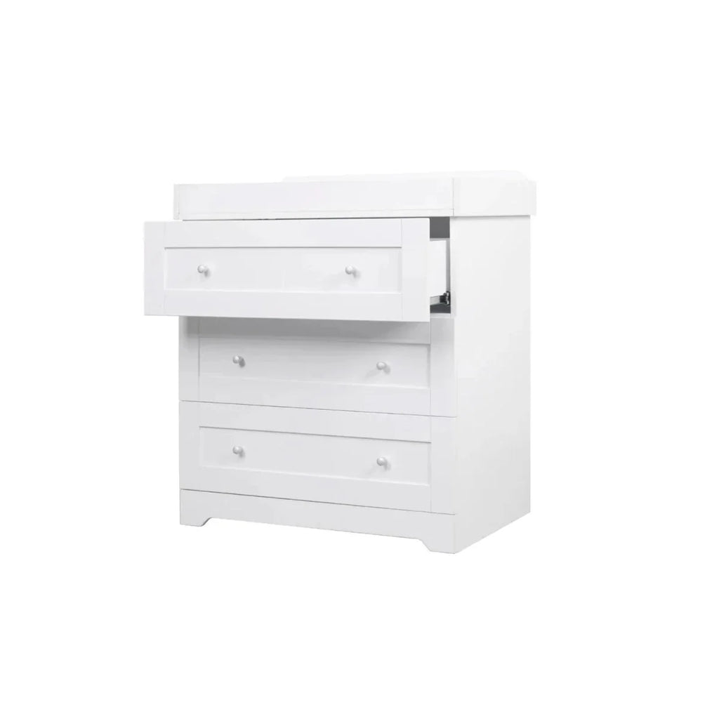 White wooden nursery dresser with three drawers and flat front panels