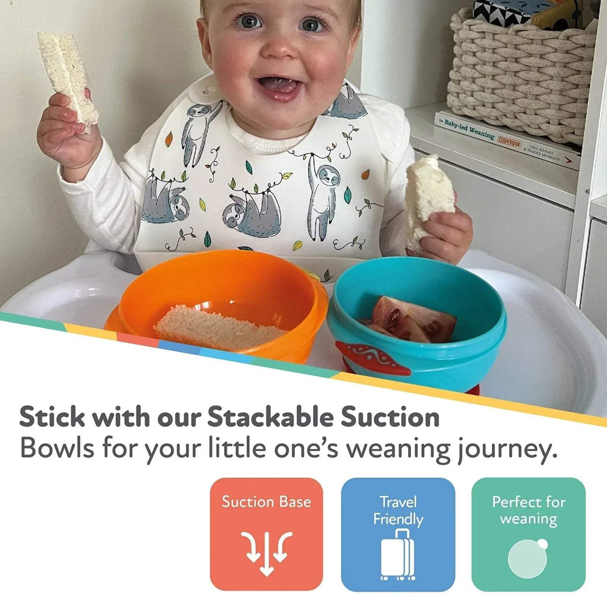Stackable suction bowls with baby at table: orange and teal bowls with suction base
