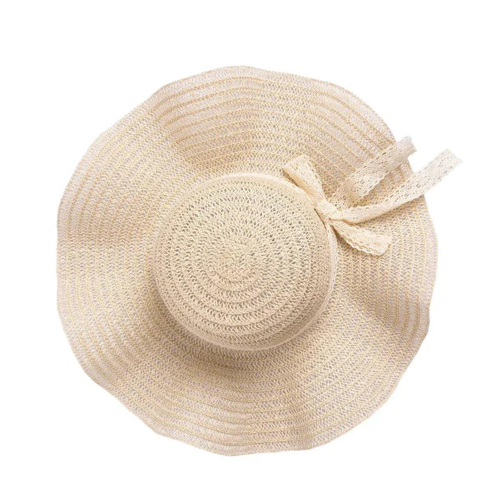 Ecru straw hat with round crown and small ribbon bow on the side
