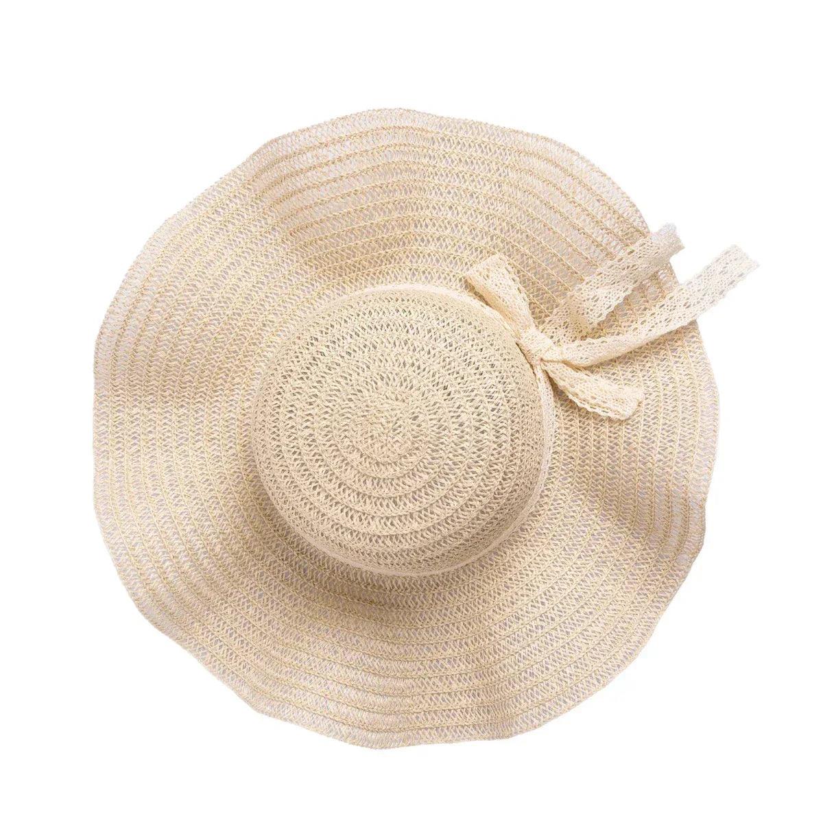 Ecru straw hat with round crown and small ribbon bow on the side
