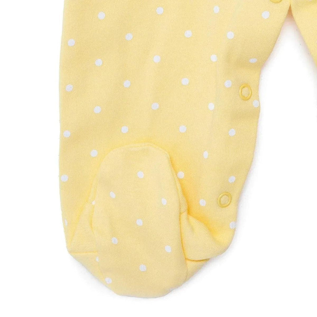 Yellow polka-dot footed baby sleepsuit with snap opening at the ankle
