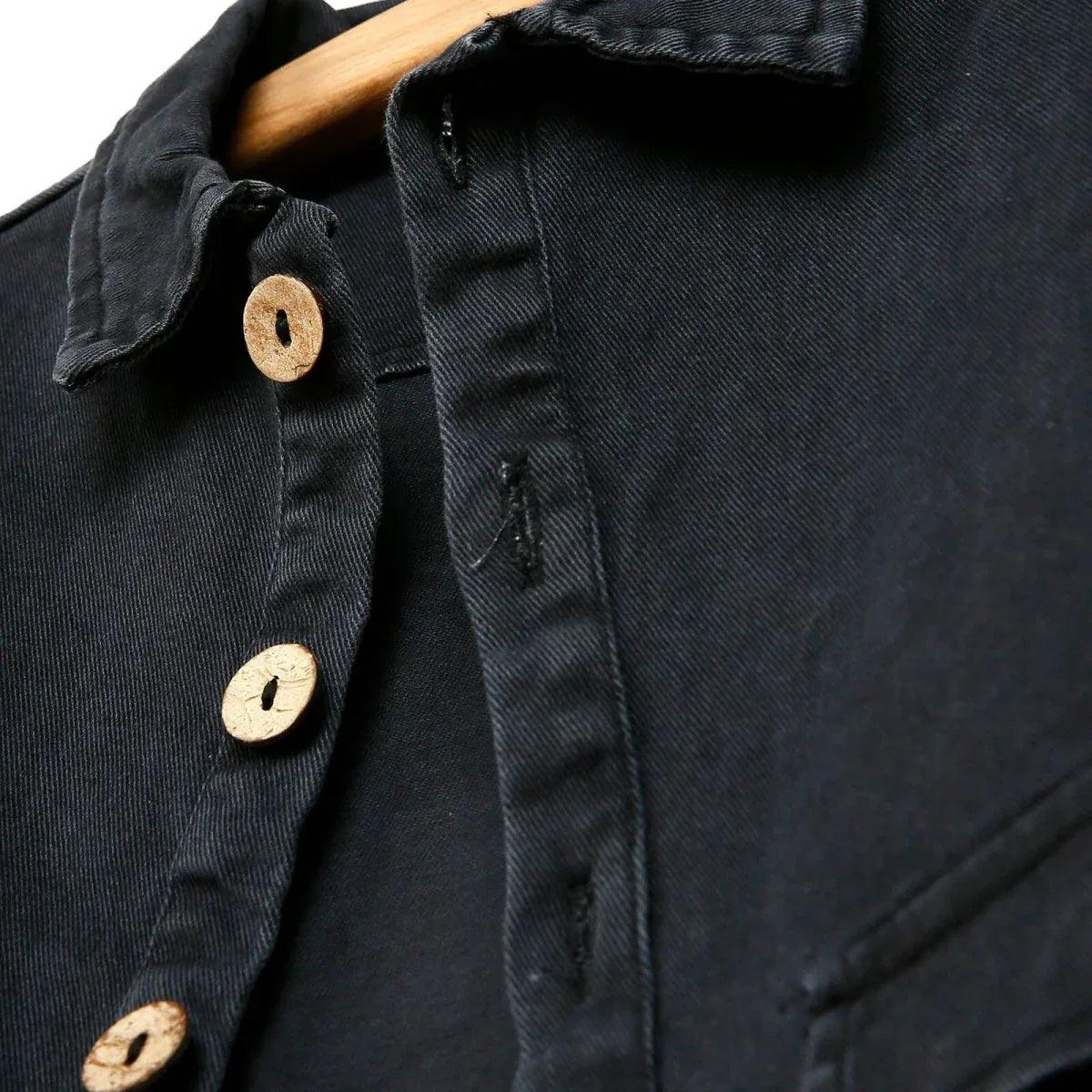 Dark anthracite baby jacket detail: wooden buttons and shirt-style collar