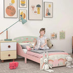 Pink kids bed frame with guard rails, illustrated side panel, and wooden slat mattress base