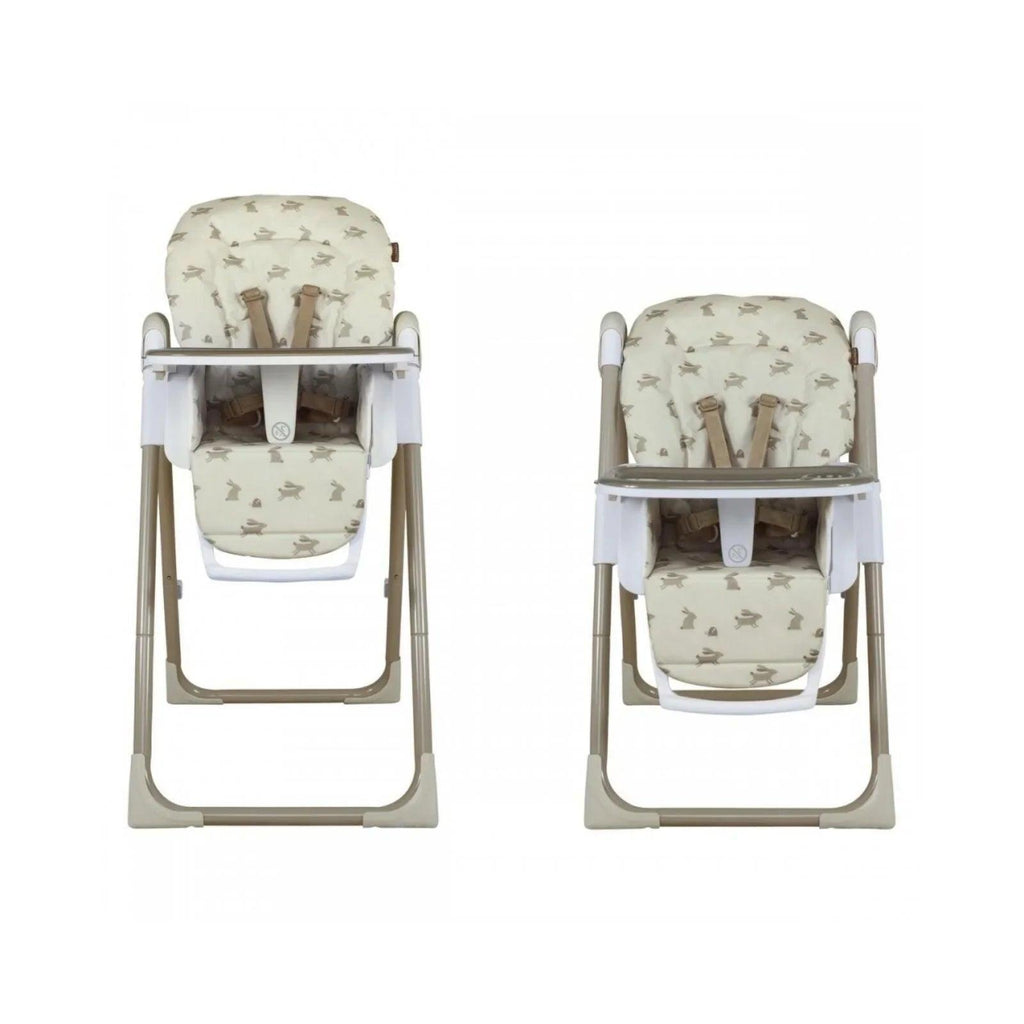 Two baby highchairs with cream animal print cushions and white trays, front views.