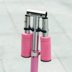 Pink scooter dual telescoping handlebar support with black clamps and metal frame