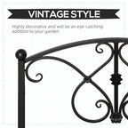 Close-up of black metal bridge rail with decorative scrollwork and finial posts