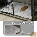 Interior view of grey plush cushion in black wire dog crate end table