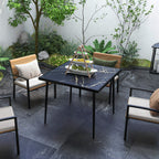 Black square patio dining table with marble-effect tempered glass top and steel frame