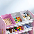 Pink toy box bench with open compartments filled with colorful toys