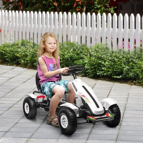 White kids pedal go-kart with black seat and steering wheel, shown with a child riding