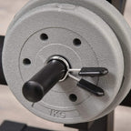 Textured weight plate with knurled handle grip, labeled 1KG